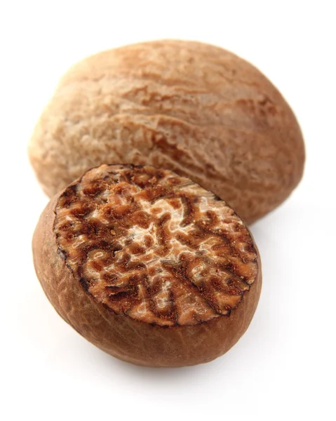 Nutmeg on a white background — Stock Photo, Image
