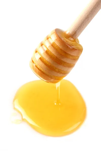 Söt honung med trä sked — Stockfoto