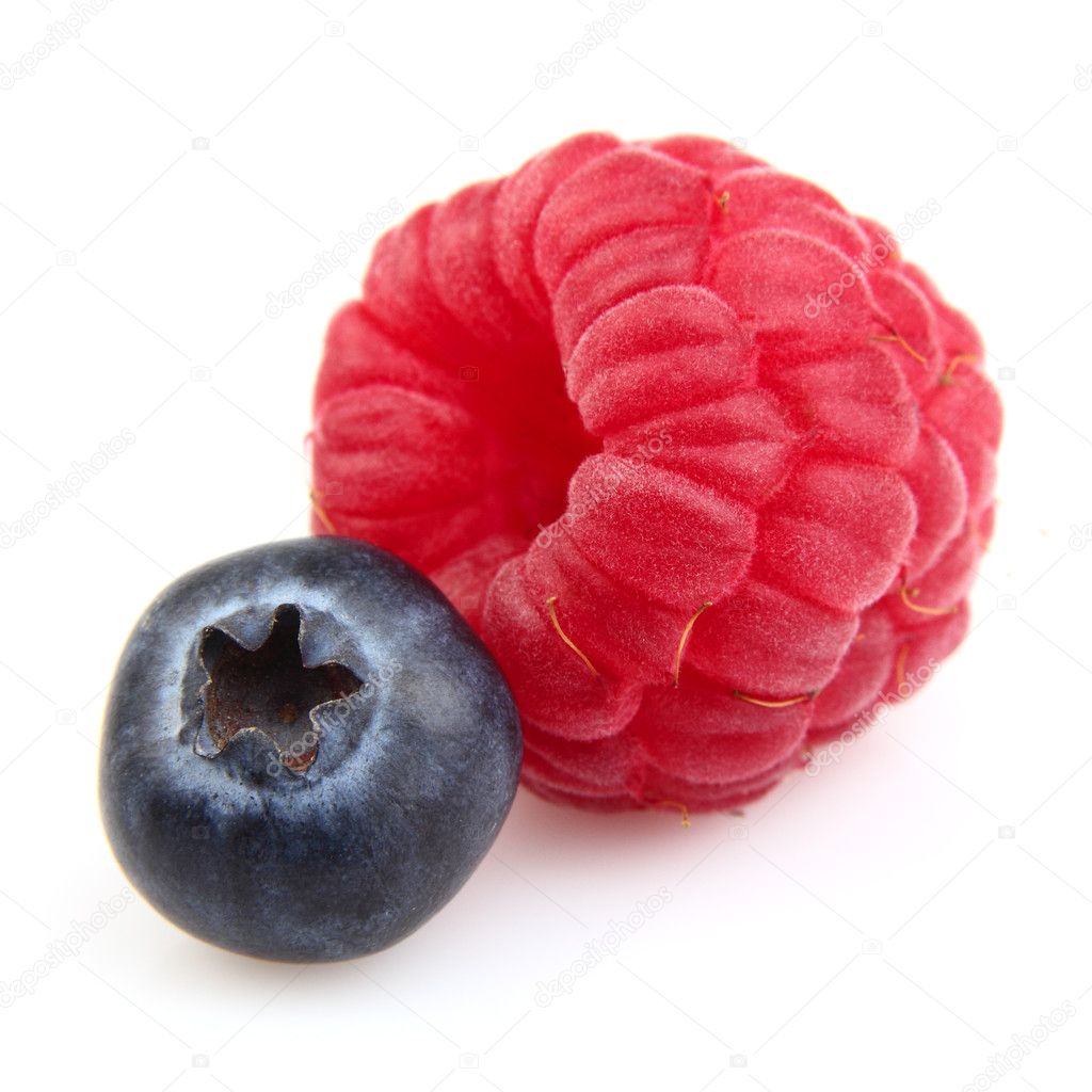 Raspberry with blueberry . Macro shooting