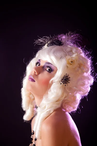 Portrait of young woman in white colonial wig Stock Image