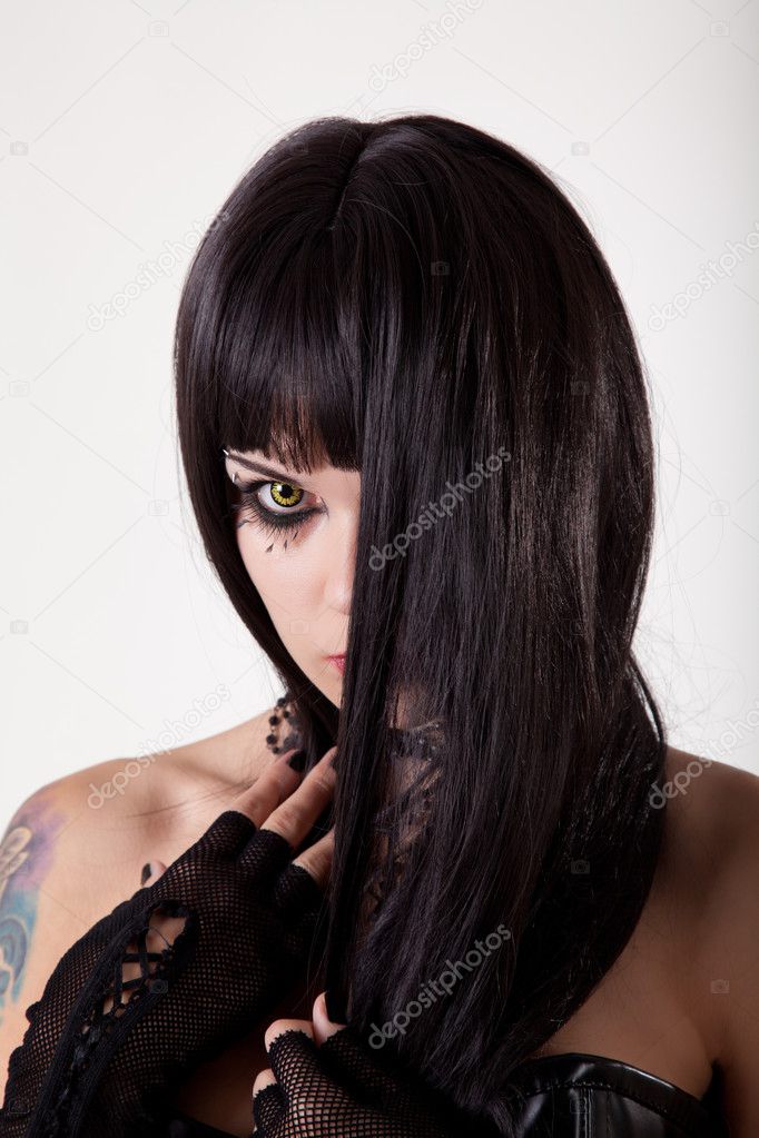 Young gothic woman with yellow eyes