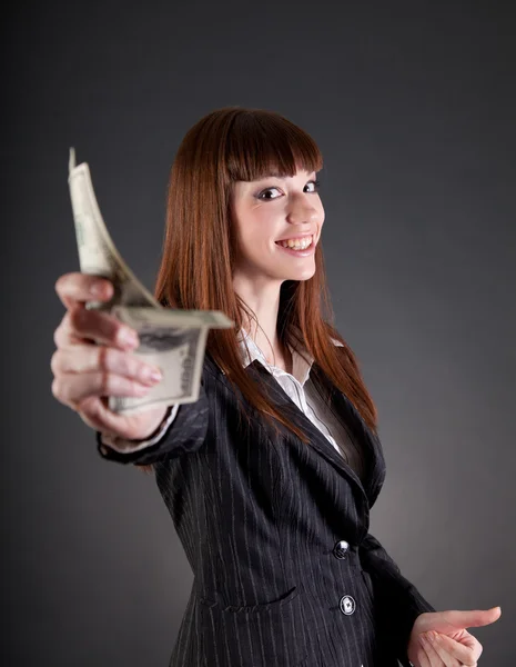 Femme d'affaires souriante avec des dollars — Photo