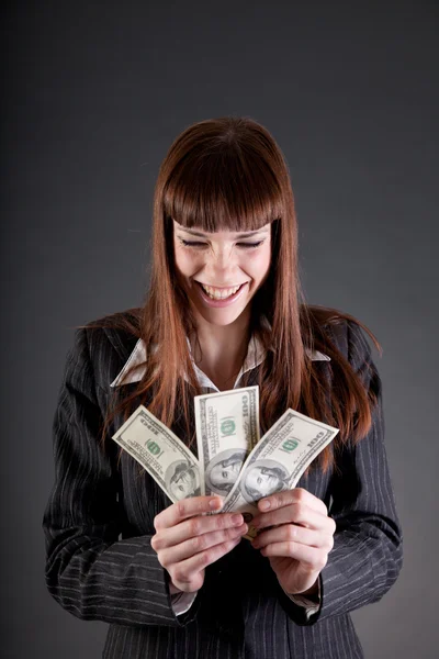 Skrattande affärskvinna med dollar — Stockfoto