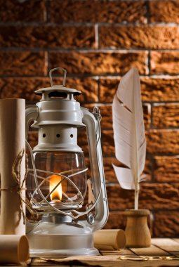 Composition of old writing items and kerosene lamp clipart