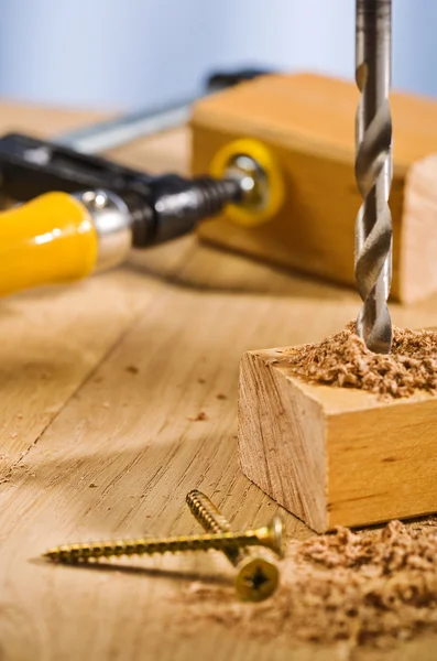 Drilling hole in a wooden plank. — Stock Photo, Image