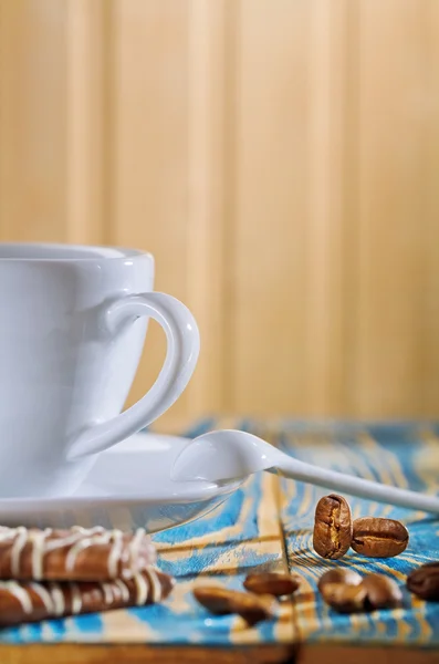 Cup and cookies with coffee beans — Stock Photo, Image