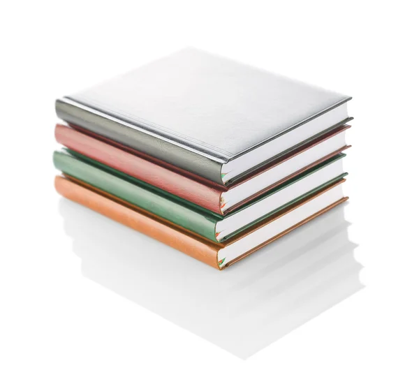 Stack of four diaries isolated — Stock Photo, Image