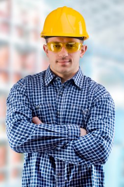 Worker on the blurred background of a department clipart