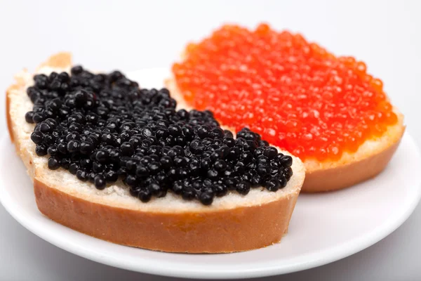 Two sandwichs with red and black caviar — Stock Photo, Image