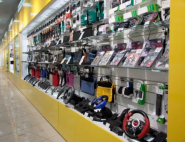 Elektronisk gadget i butik. blured — Stockfoto
