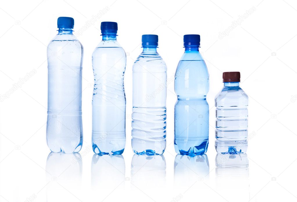Group plastic bottles of water isolated on white