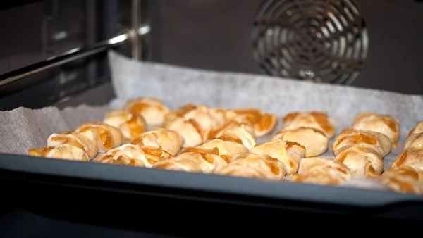 stock image Fresh baked homemade cookies in oven.