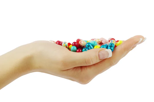 Mão segura pílulas — Fotografia de Stock