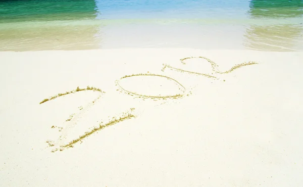 stock image 2012 on beach sand