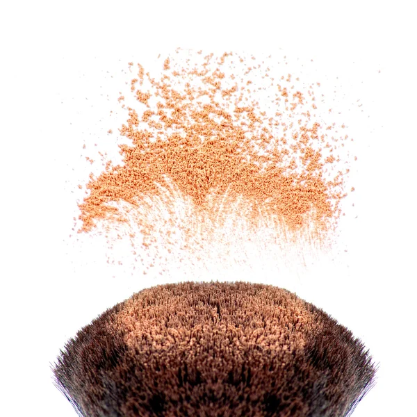 Makeup brushes and powder in motion — Stock Photo, Image
