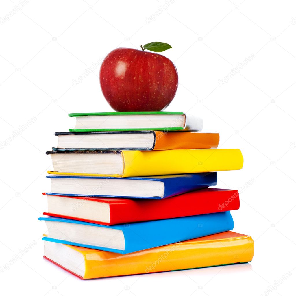 Books tower with apple isolated on white