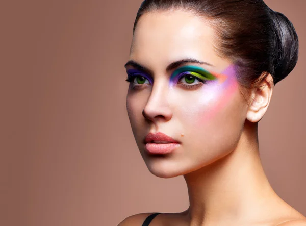 Beautiful young female face with bright fashion multicolored mak Stock Image