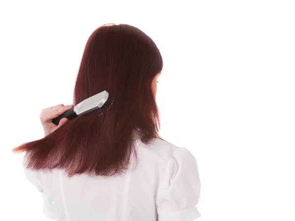 Flicka borstar håret. — Stockfoto