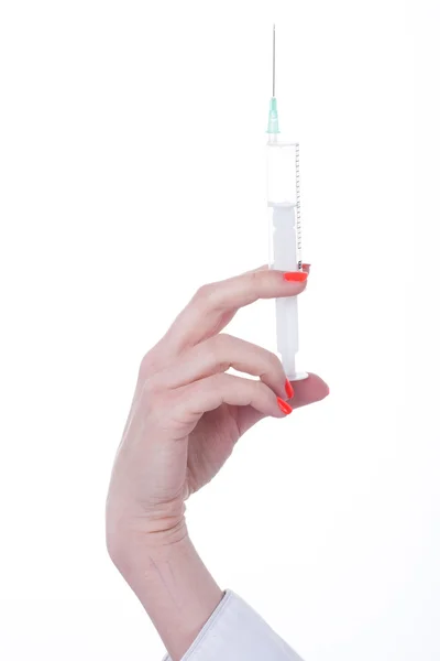 Hand brings syringe Stock Image
