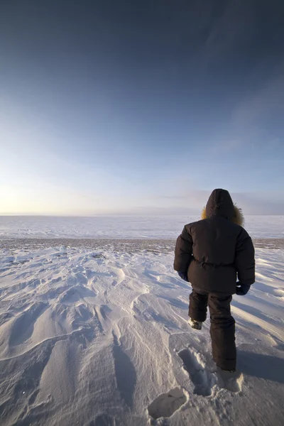 Walking boy in snow — Stock Photo, Image