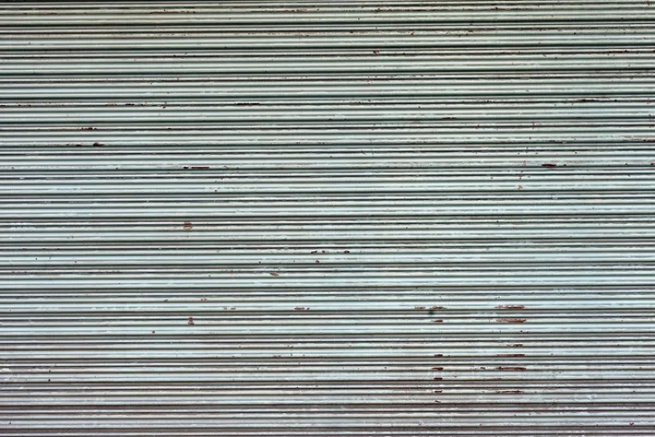 Verlichte grunge metalen deur samenvouwen — Stockfoto
