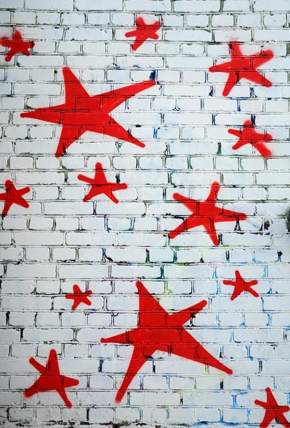 Red Stars on White Brick Wall — Stock Photo, Image
