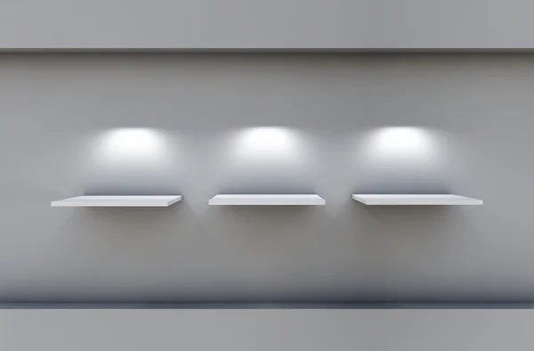 Три 3D полки и прожекторы для выставки в сером интерьере — стоковое фото