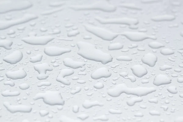 Gotas de água no fundo cinza — Fotografia de Stock