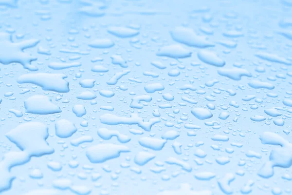 Water drops on blue background — Stock Photo, Image