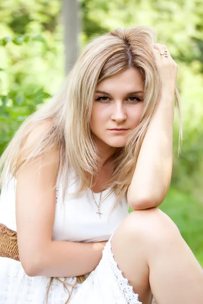 stock image Young cute girl resting in fresh spring grass