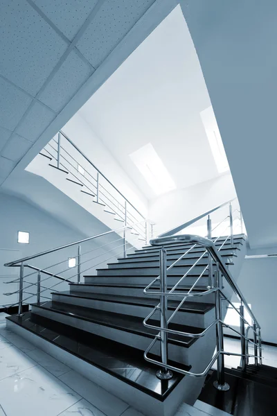 Marble staircase with a steel handrail — Stock Photo, Image