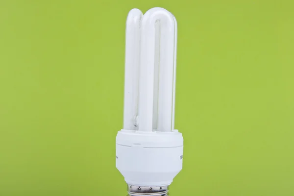 Bulb on green background — Stock Photo, Image