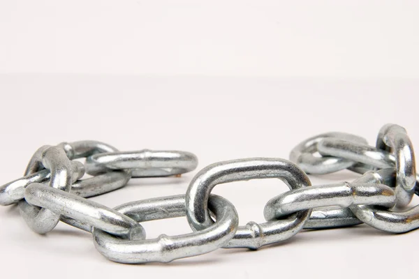 Metallic chain on white background — Stock Photo, Image
