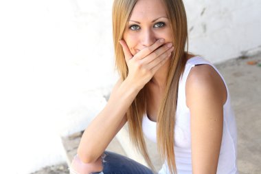 Young blonde woman making funny faces clipart