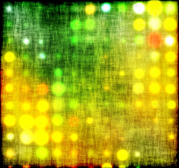 Bakgrund med ur fokus ljusa prickar i grönt — Stockfoto