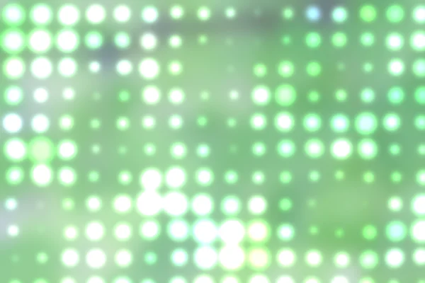 Hintergrund mit unscharfen Lichtpunkten in grün — Stockfoto