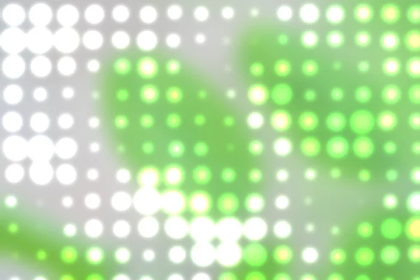 Achtergrond met uit focus licht stippen in het groen — Stockfoto