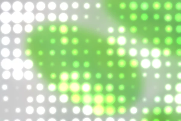 Bakgrund med ur fokus ljusa prickar i grönt — Stockfoto