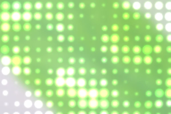 Fundo com pontos de luz fora de foco em verde — Fotografia de Stock