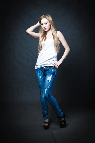 A young blonde wearing jeans shorts — Stock Photo, Image