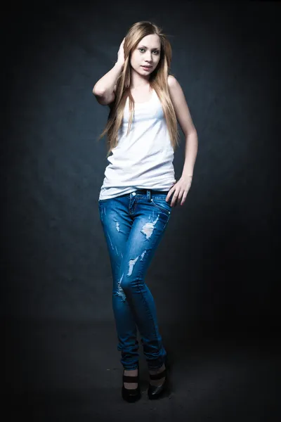 A young blonde wearing jeans shorts — Stock Photo, Image