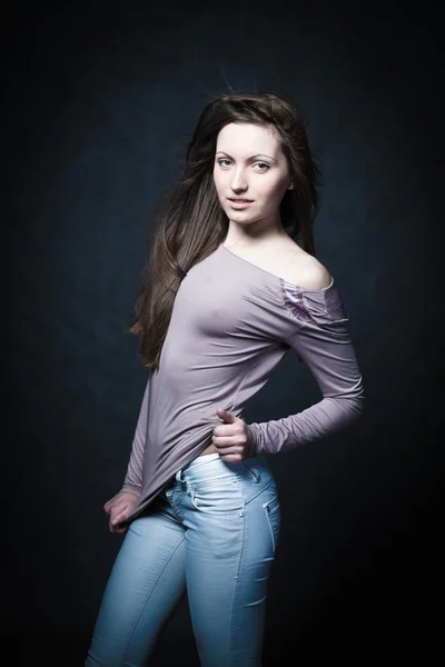Portrait of a young girl in jeans — Stock Photo, Image