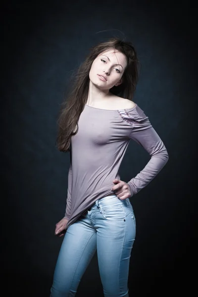 Portrait of a young girl in jeans — Stock Photo, Image
