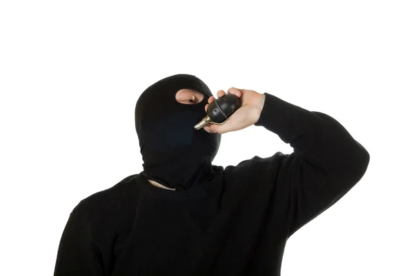 Man in black mask with russian grenade. — Stock Photo, Image