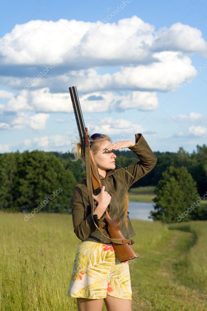 Blondie girl with a hunting rifle.