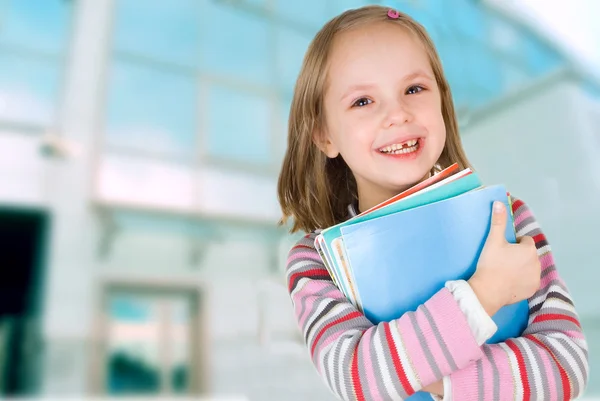 stock image Child with a stack of notebooks