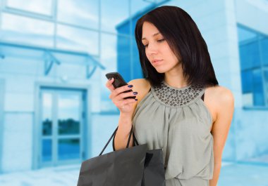 Beautiful happy woman with shopping bag