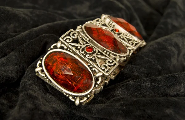 Bracelet with red stones — Zdjęcie stockowe
