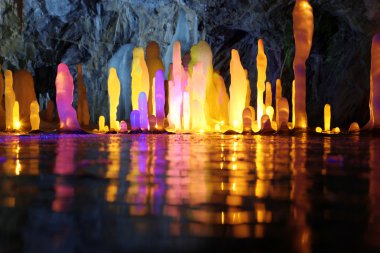 Stalagmite in deep cave North Europe clipart