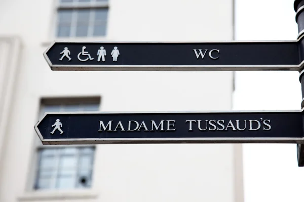London Street Signpost with Madame Tussaud's and WC — Stock Photo, Image